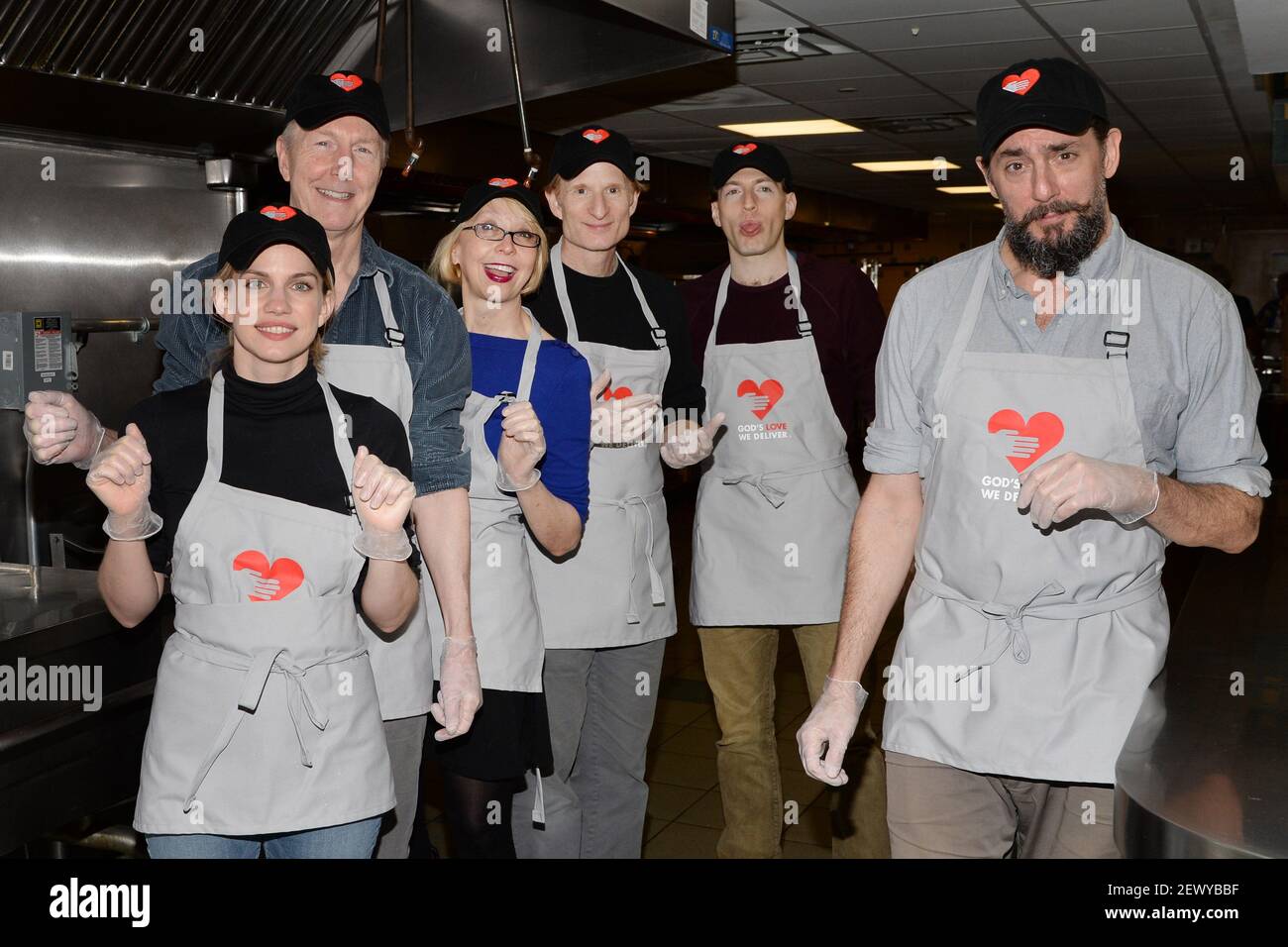 You Can't Take It With You" cast members (l-r) Anna Chlumsky, Byron  Jennings, Julie Halston, Nick Corley, Franz Kranz and Reg Rogers volunteer  to prepare meals at God's Love We Deliver kitchens