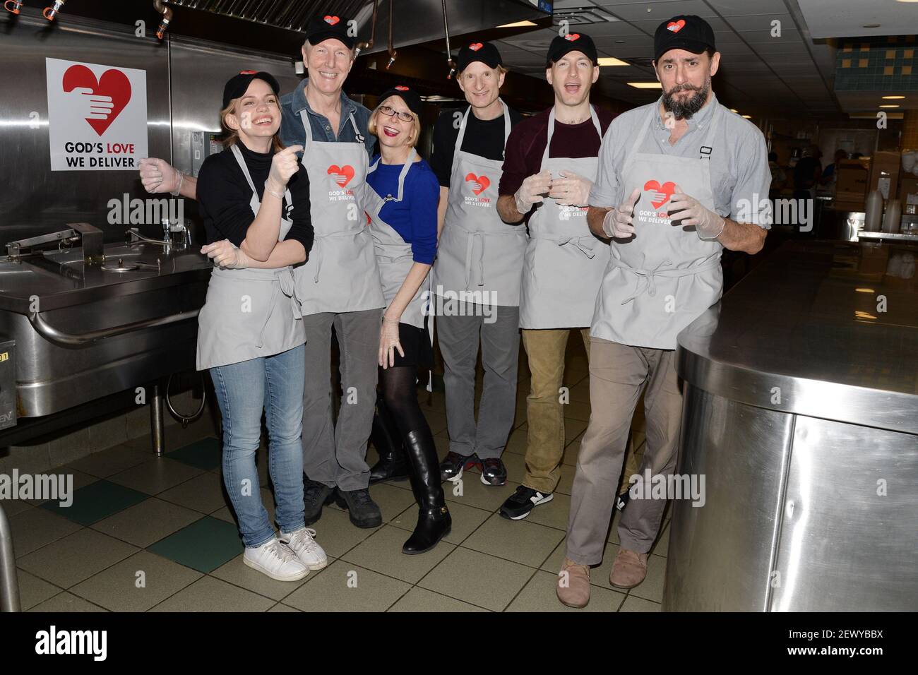 You Can't Take It With You" cast members (l-r) Anna Chlumsky, Byron  Jennings, Julie Halston, Nick Corley, Franz Kranz and Reg Rogers volunteer  to prepare meals at God's Love We Deliver kitchens