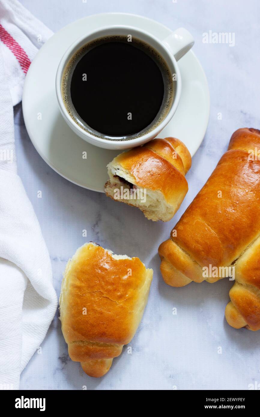 Yeast dough rolls stuffed with jam and nuts. Stock Photo