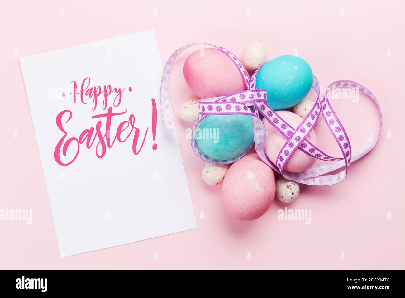 Easter greeting card with colorful easter eggs on pink background. Top ...