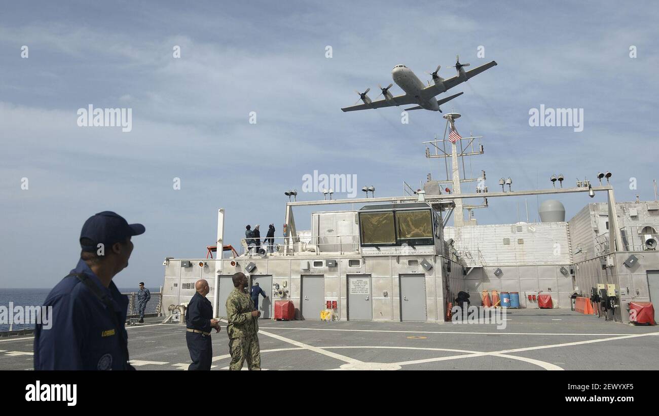 ATLANTIC OCEAN (Jan. 19, 2015) A Portuguese P-3 Orion aircraft conducts a fly-by over of the Military Sealift Command joint high-speed vessel USNS Spearhead (JHSV 1). Spearhead is on a scheduled deployment to the U.S. 6th Fleet area of responsibility to support the international collaborative capacity-building program Africa Partnership Station. (Photo by Mass Communication Specialist 1st Class Joshua Davies/U.S. Navy) *** Please Use Credit from Credit Field *** Stock Photo