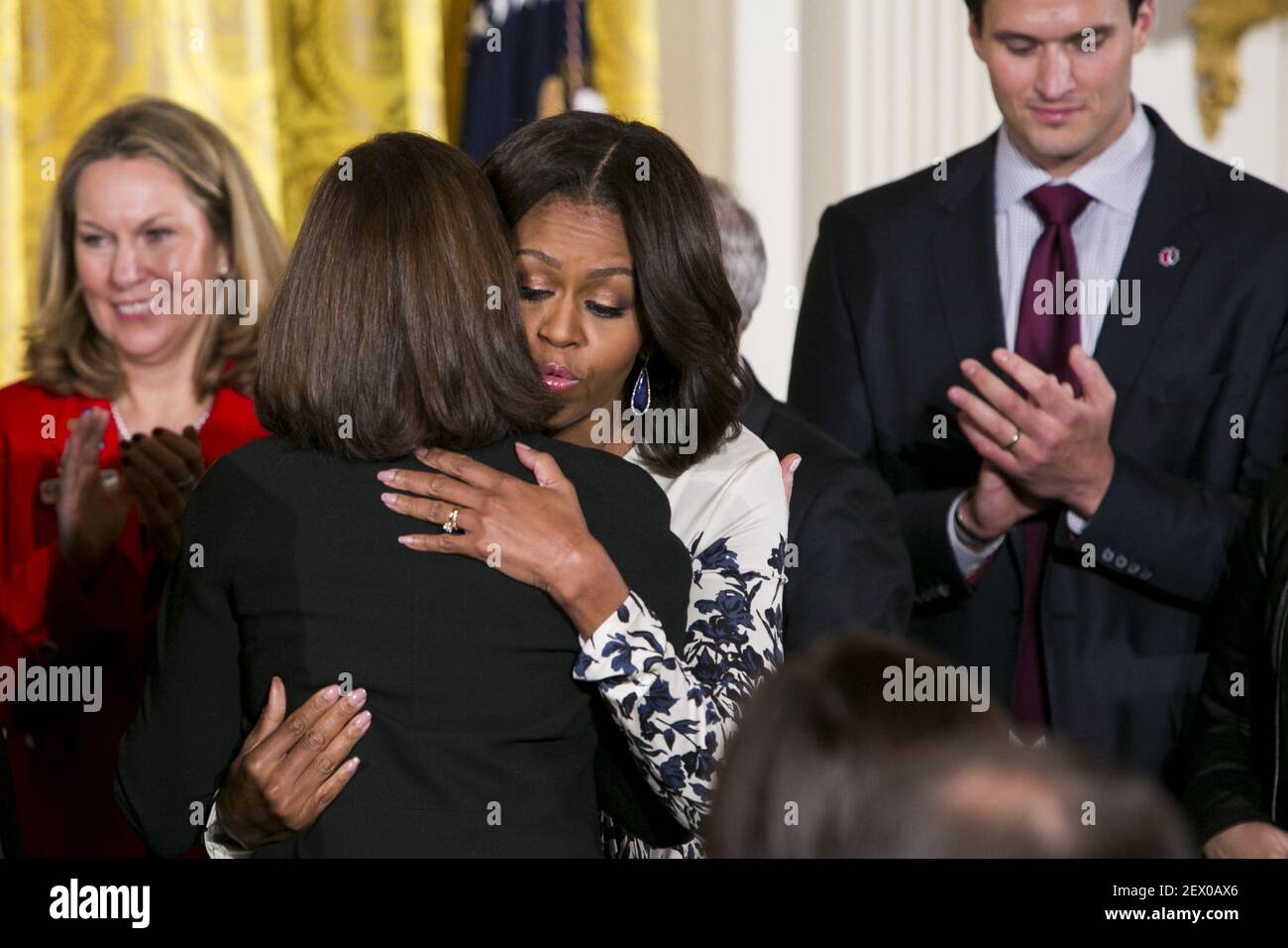 First Lady Michelle Obama hugs the mother of Clay Hunt following the signing ceremony for the Clay Hunt Suicide Prevention for American Veterans Act in the East Room of the White House in Washington, D.C. on February 12, 2015. Photo Credit: Kristoffer Tripplaar/ Sipa USA *** Please Use Credit from Credit Field *** Stock Photo