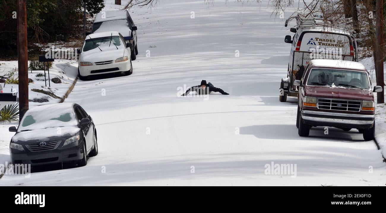 Oscar Barbaza, 14, enjoys a totally empty Sprunt Ave on Tuesday, Feb. 17, 2015 in Durham, N.C. A winter storm that made it's way across the region Monday night made roads and sidewalks hazardous. (Chuck Liddy/News & Observer/TNS) *** Please Use Credit from Credit Field *** Stock Photo
