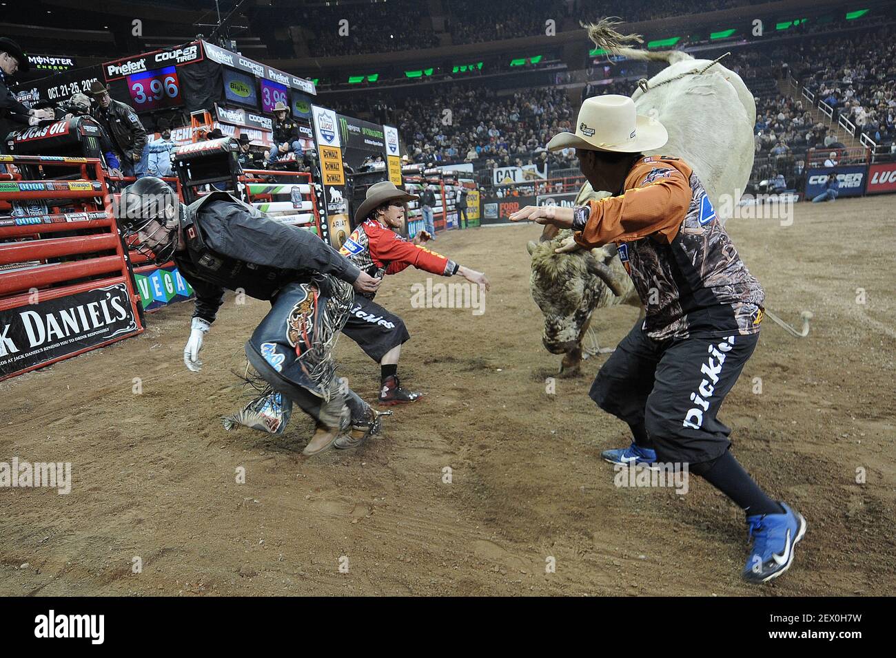 Bull Riding Delta Center Two bull wranglers distract a bull named Delta Force as rider Jordan ...