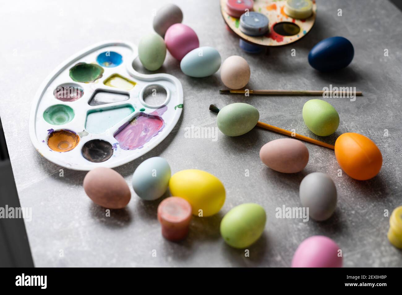 colouring eggs for eastertime at home Stock Photo