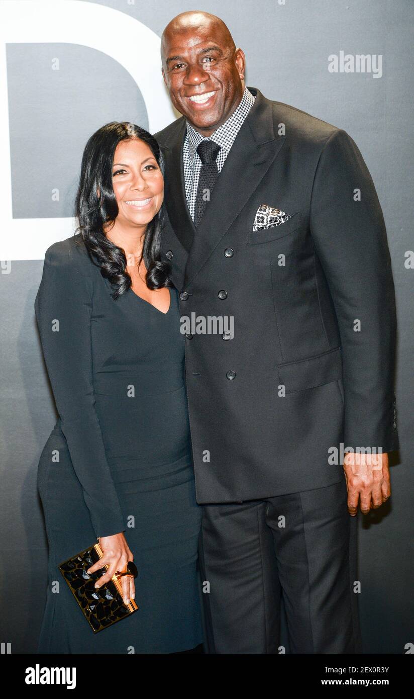 Magic Johnson and his wife Cookie attend the 2015 Tom Ford Women's  Collection held at Milk Studios in Hollwyood, CA on February 20, 2015.  (Photo By Anthony Behar) **Please Use Credit From