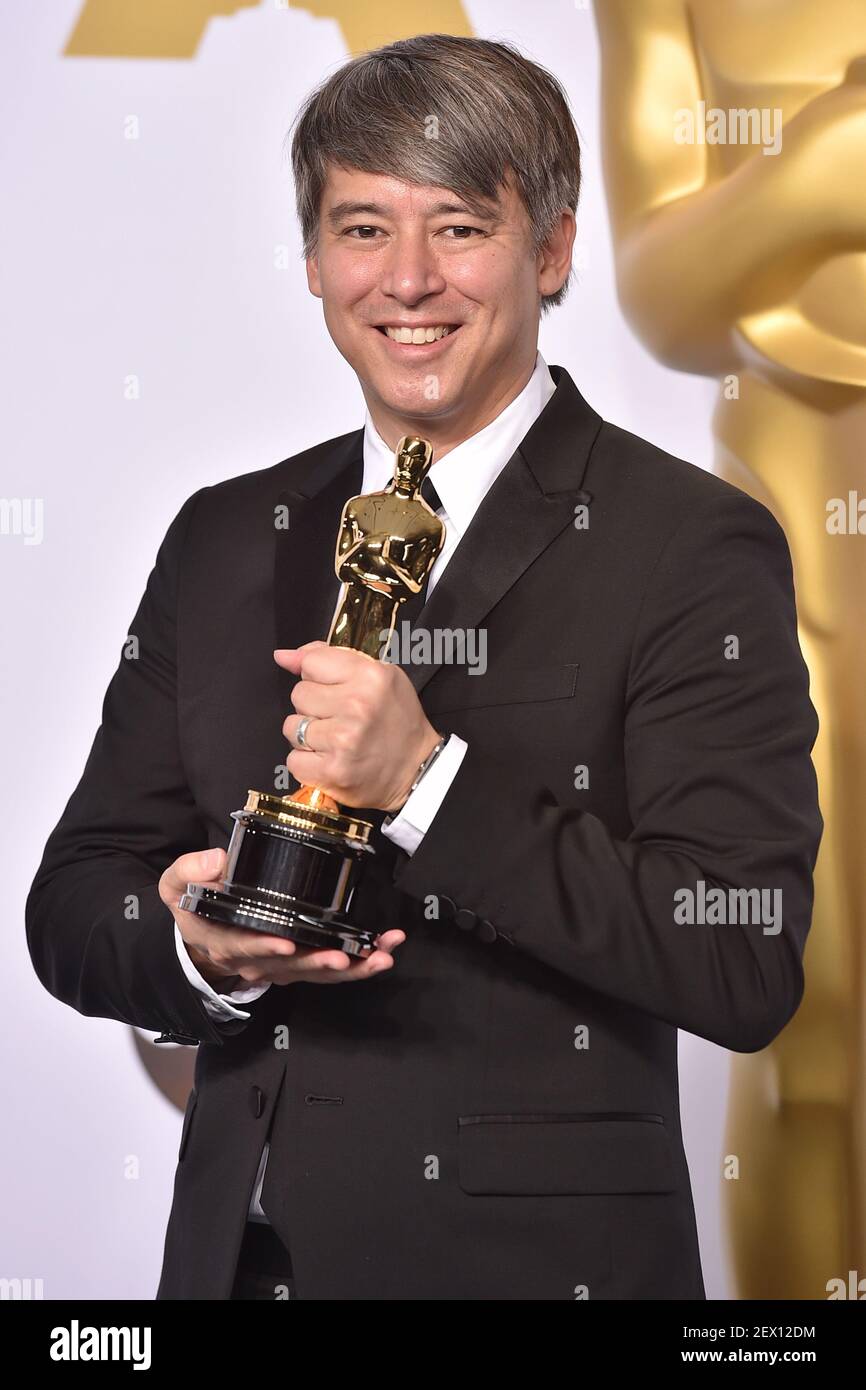 Best Film Editing Winner Tom Cross for the film Whiplash poses in the