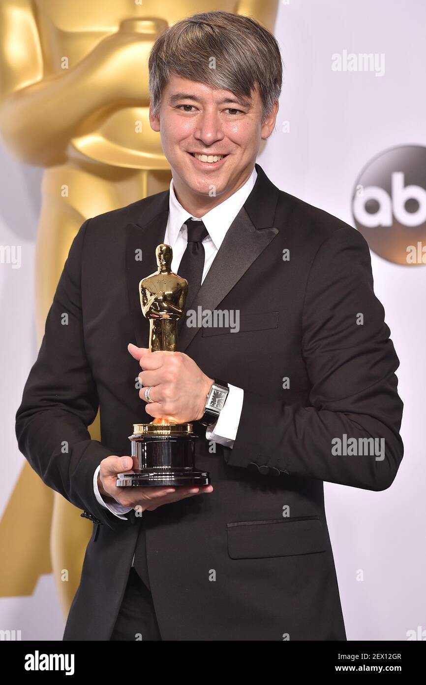 Best Film Editing Winner Tom Cross for the film Whiplash poses in the