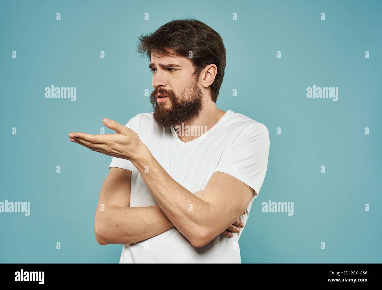 Man indignant look portrait emotions blue background model Stock Photo Alamy