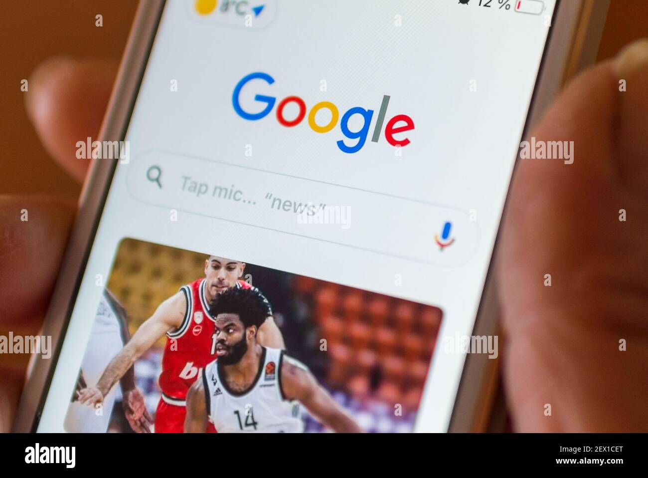 Smartphone with Google logo on the screen. White background. Google is the biggest Internet search app in the world. Telsiai Lithuania 02 March 2021 Stock Photo