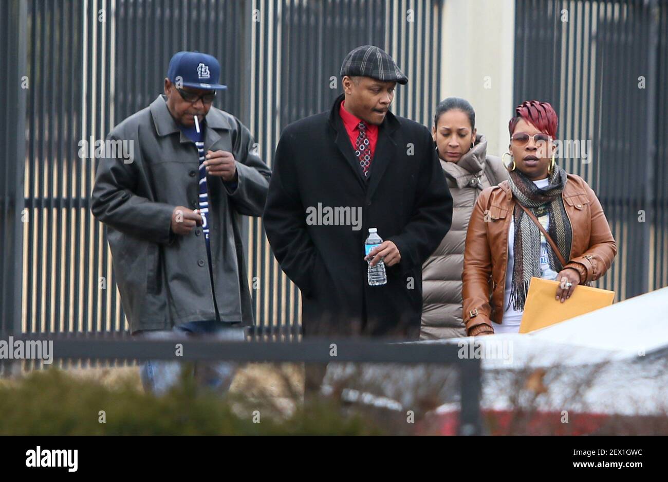 Michael Brown's mother, Lesley McSpadden, pictured at far right, leaves the FBI offices in St. Louis after meeting with federal officials on Wednesday, March 4, 2015. (Photo by David Carson/St. Louis Post-Dispatch/TNS) *** Please Use Credit from Credit Field *** Stock Photo