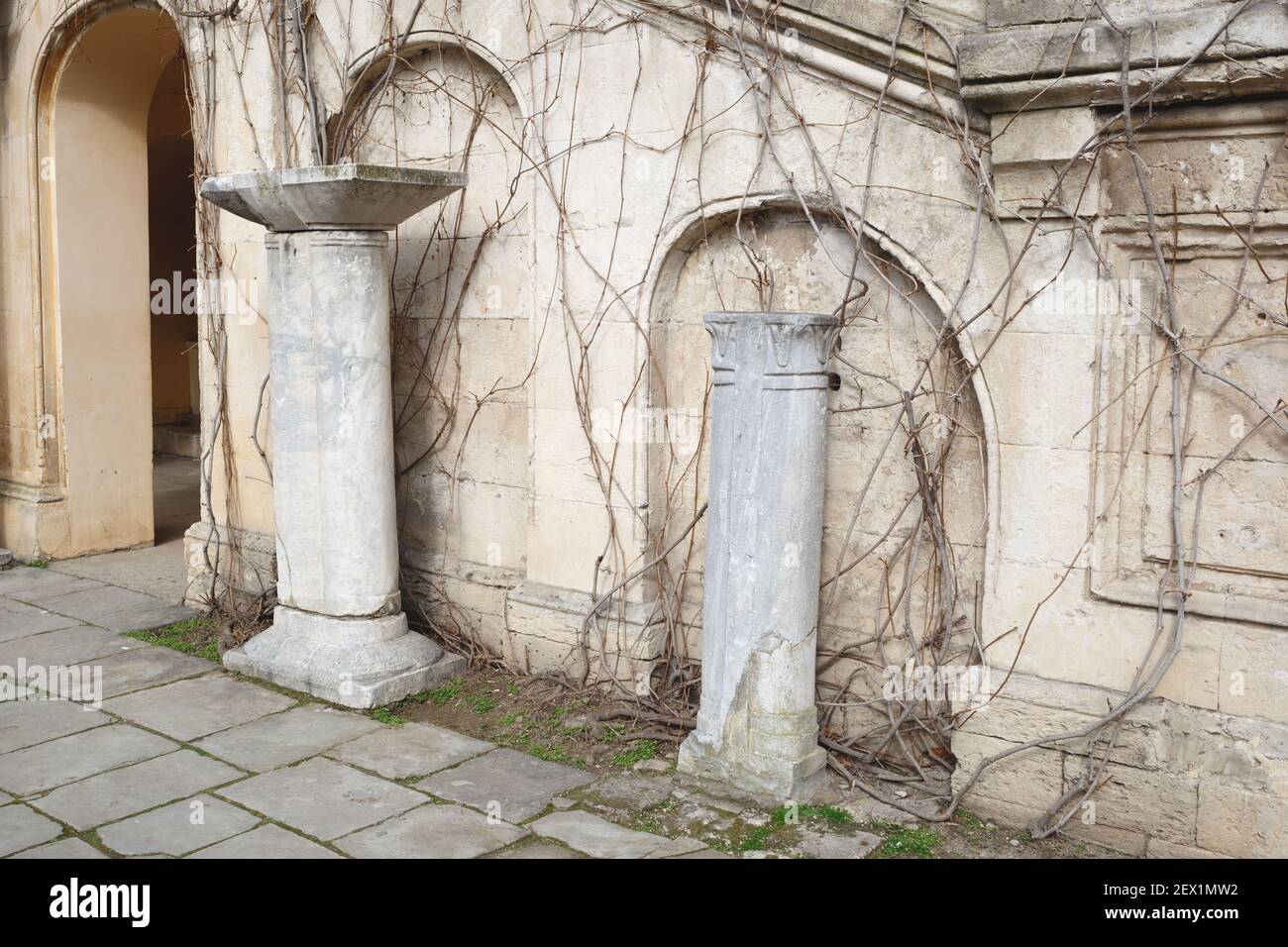 ancient greek building with antique columns and arched windows Stock Photo