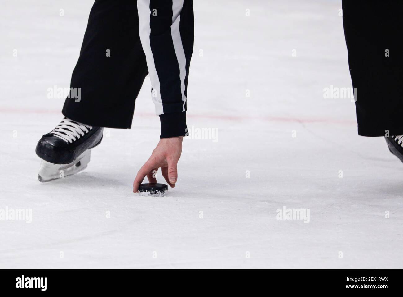 Moscow, Russia. 3rd March, 2021. KHL Regular Season ice hockey match: CSKA Moscow Vs Spartak Moscow - Moscow CSKA Arena. Hockey disk and linesman. Stock Photo