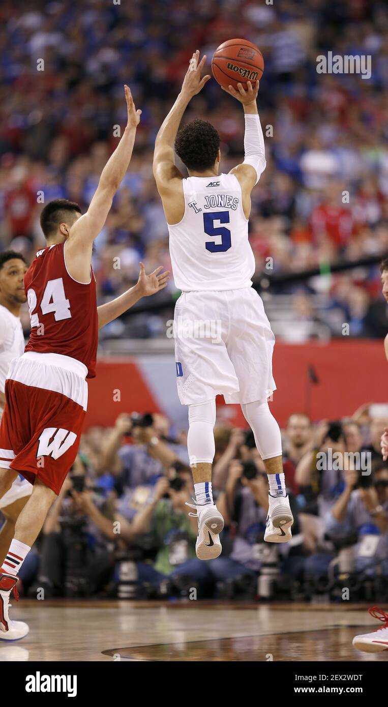 Duke Blue Devils guard Tyus Jones (5) hits a late three-pointer during the NCAA National Championship game on Monday, April 6, 2015, at Lucas Oil Stadium in Indianapolis. (Photo by Sam Riche/TNS) *** Please Use Credit from Credit Field *** Stock Photo
