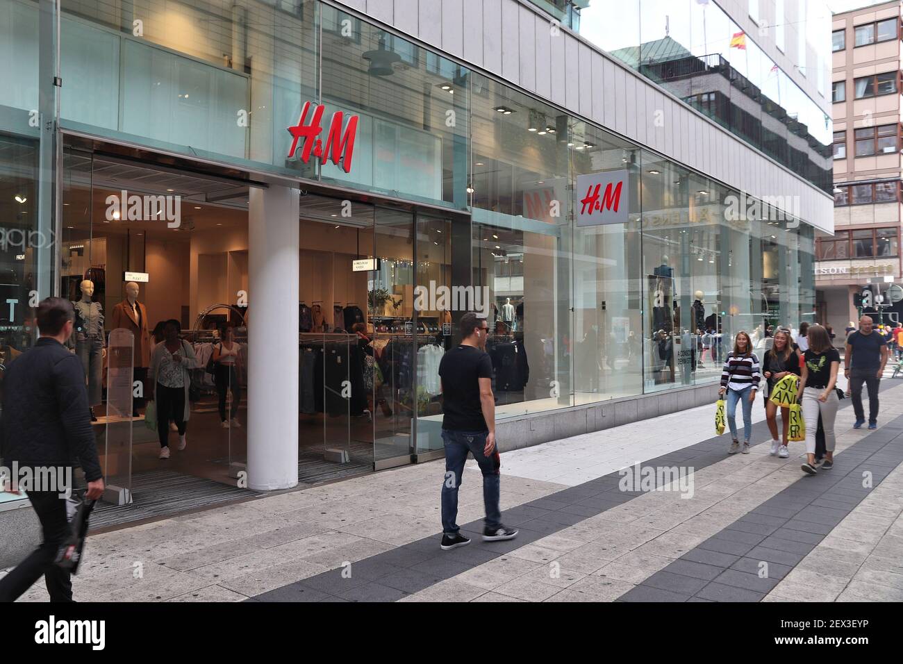 STOCKHOLM, SWEDEN - AUGUST 23, 2018: People walk by H and M (H&M) fashion  store in Stockholm, Sweden. H&M is a Swedish brand known internationally  for Stock Photo - Alamy