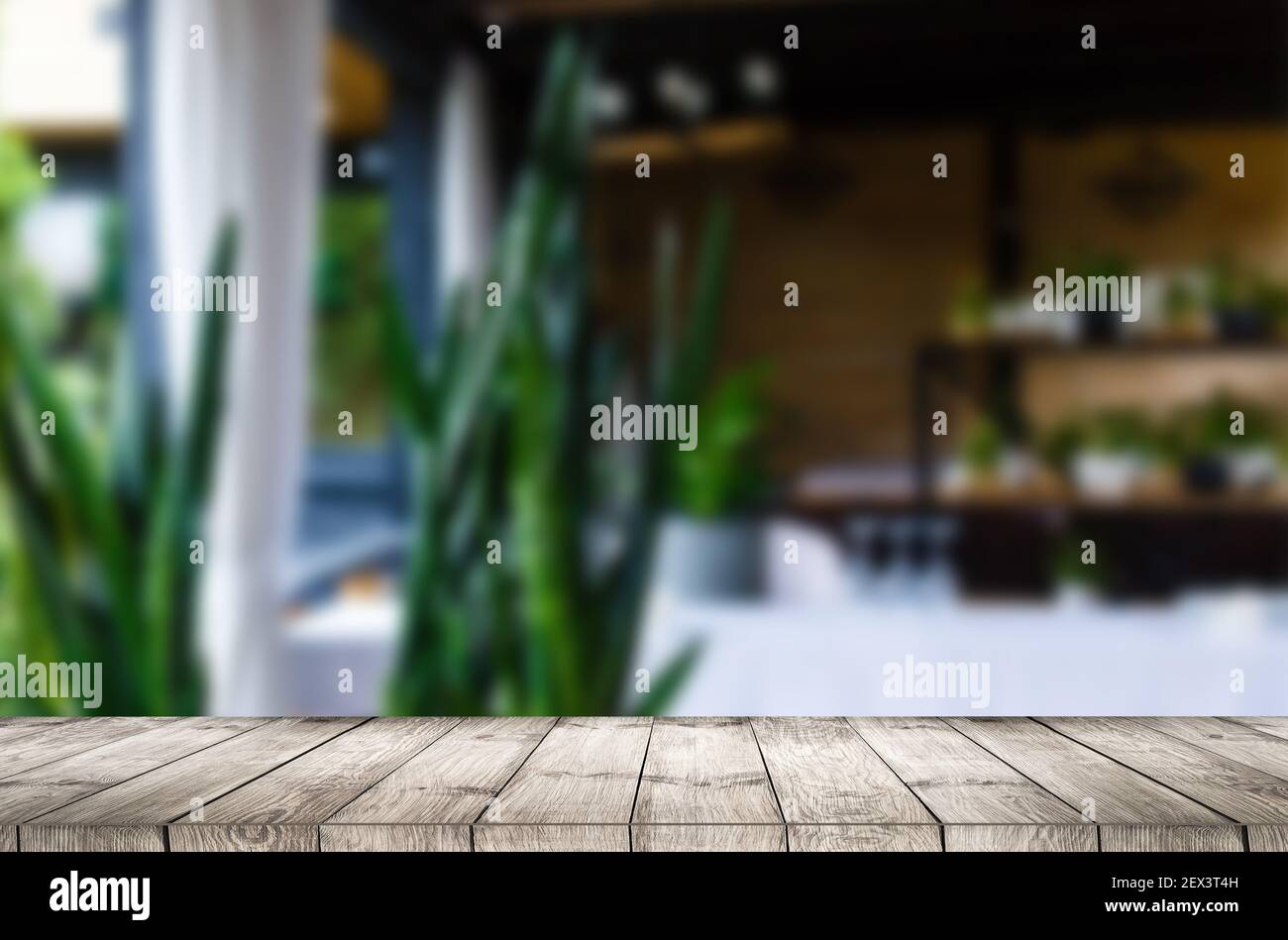 Wooden table and blur restaurant background Stock Photo - Alamy