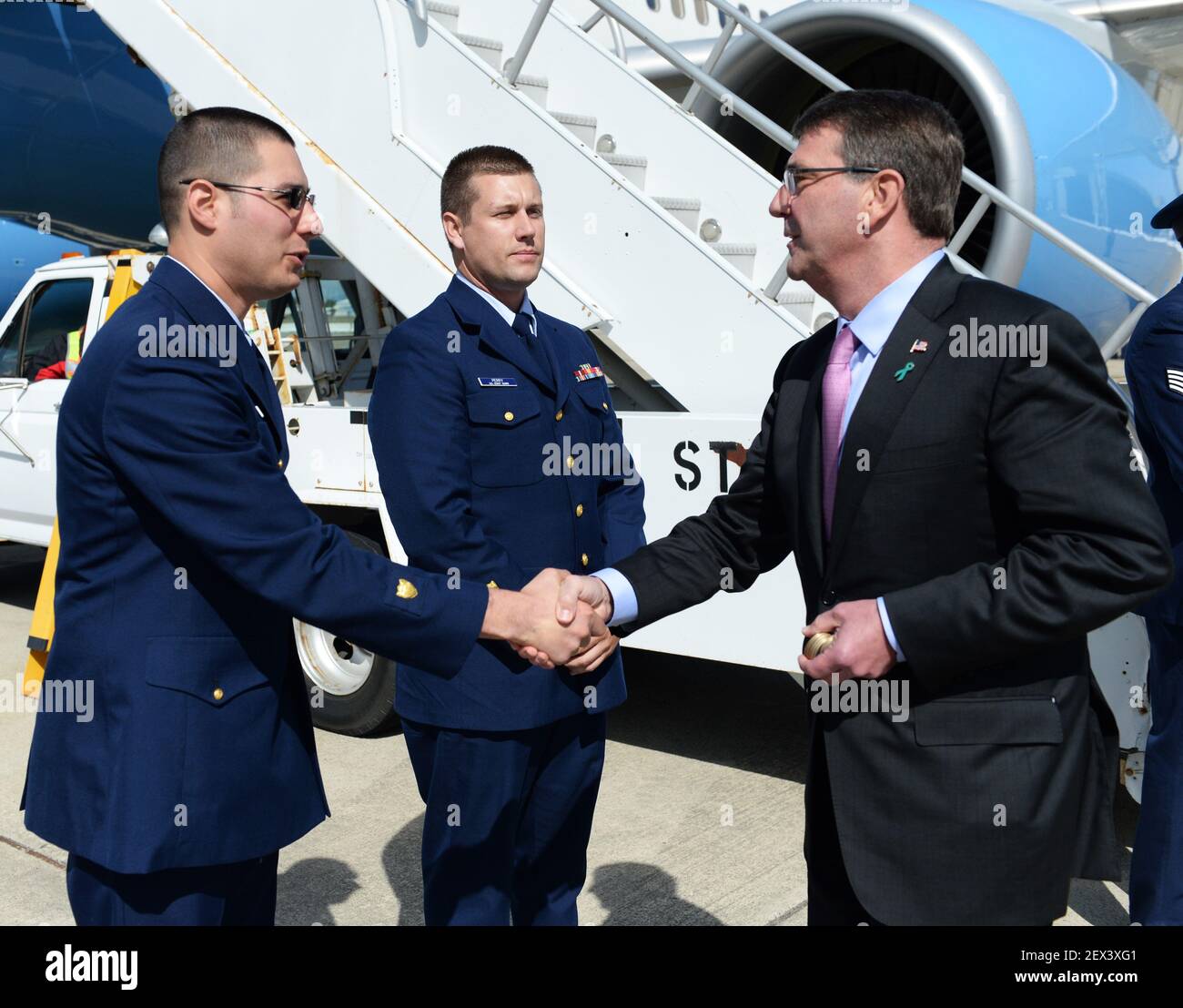 Secretary of Defense Ash Carter presents Coast guardsmen with the ...