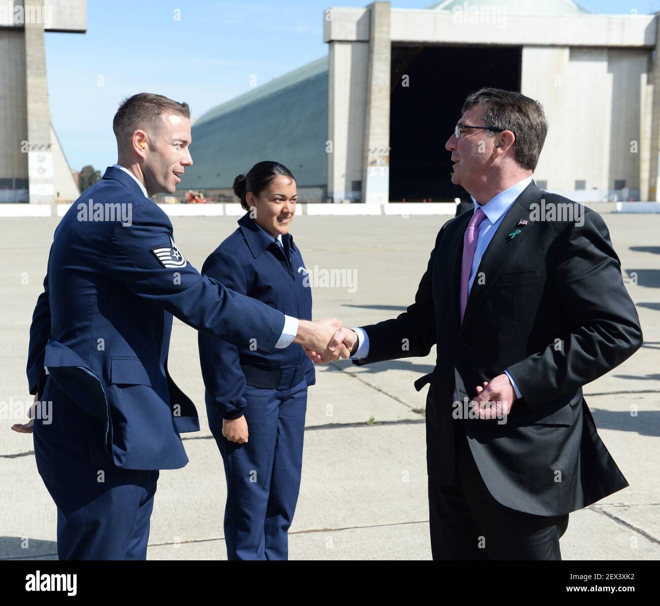 Secretary of Defense Ash Carter presents Airmen with the SECDEF coin ...