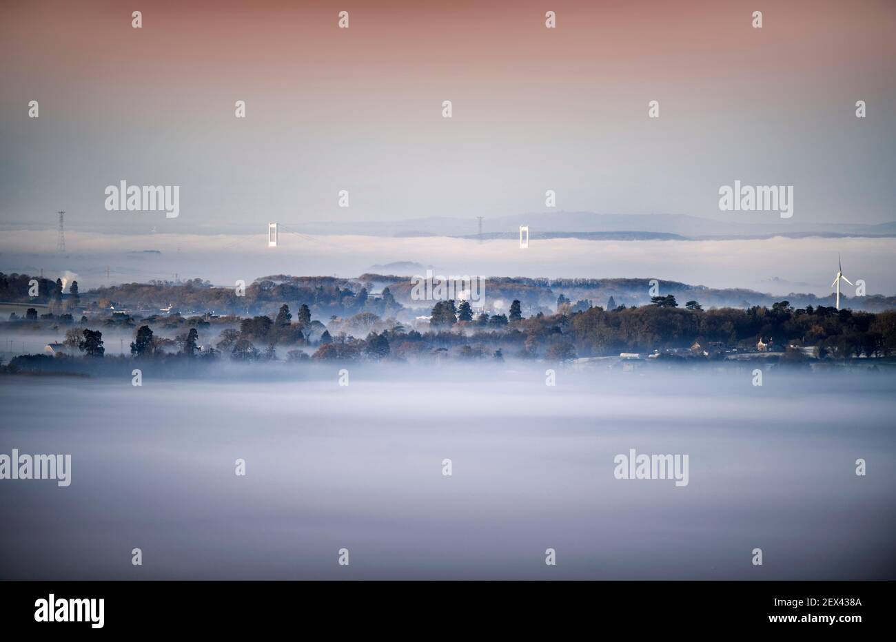 Misty views from the Cotswold Escarpment near Wotton-under-Edge in Gloucestershire looking towards the original Severn Bridge Stock Photo