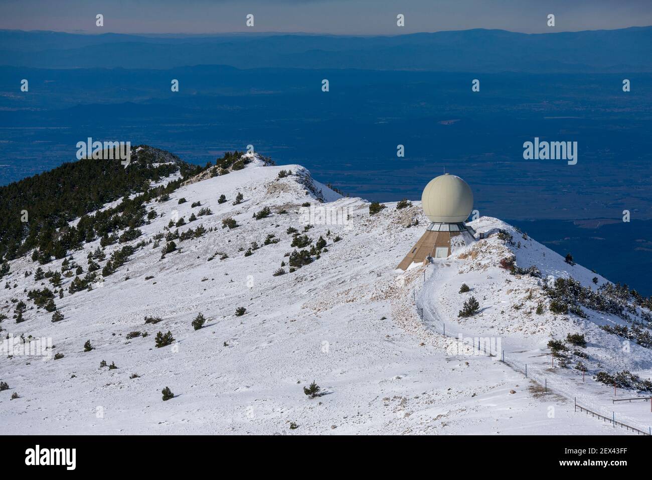 The Radome in the limestone scree on the northern slope of the summit of Mont Ventoux in snow, Vaucluse 84, Provence-Alpes-Cote d'Azur, France Stock Photo