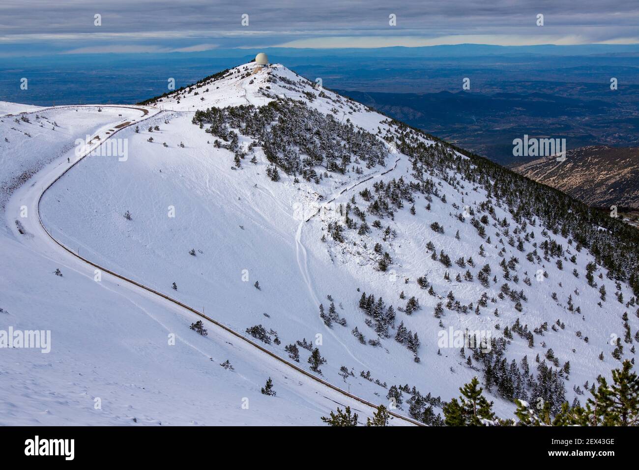 The Radome and the Route du Mont Serein in the limestone scree on the northern slope of the summit of Mont Ventoux in snow, Vaucluse 84, Provence-Alpe Stock Photo