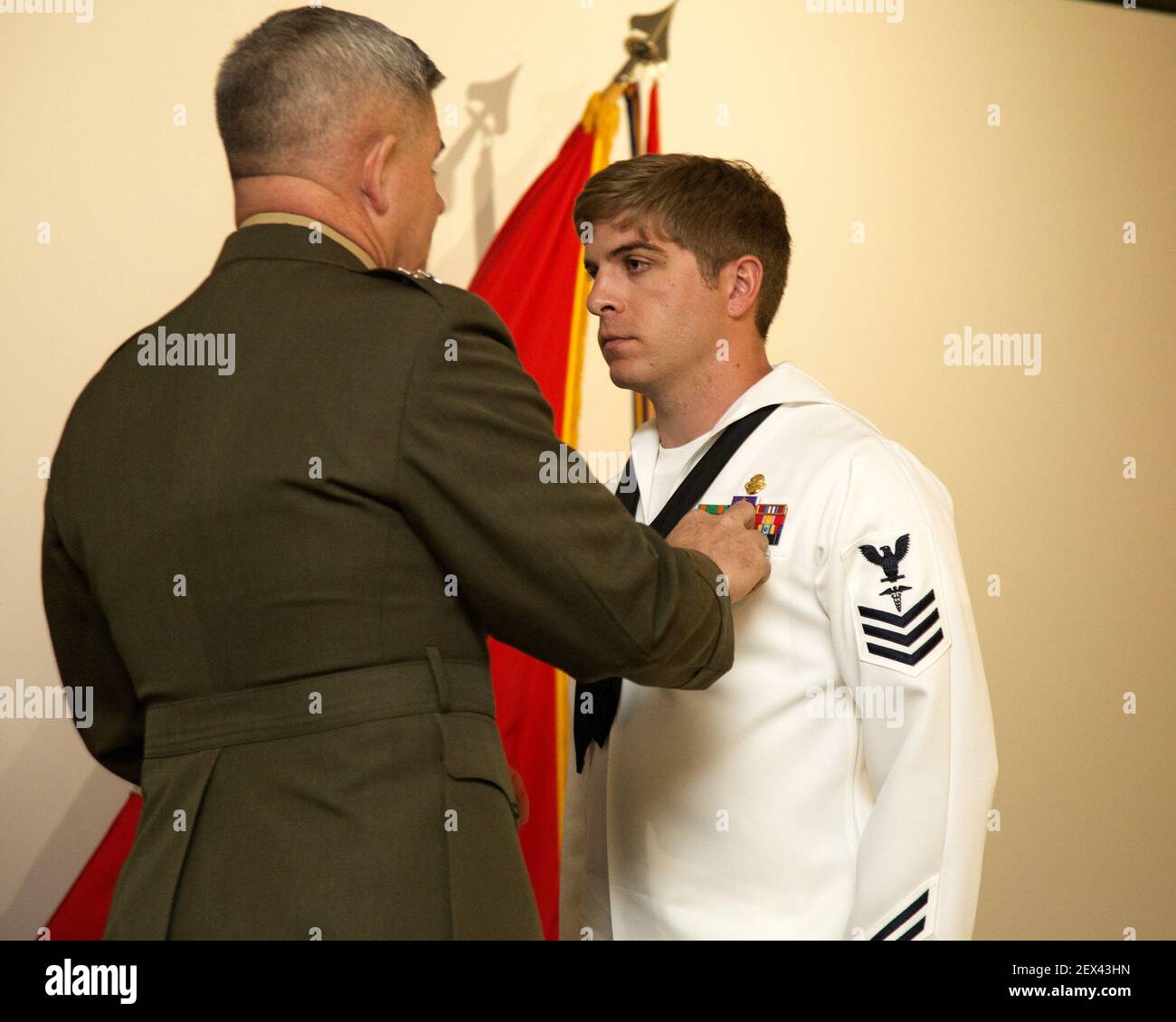 CAMP LEJEUNE, N.C. (March 20, 2015) Major Gen. Joseph L. Osterman,  commander, U.S. Marine Corps Forces Special Operations Command, awards  Hospital Corpsman 1st Class Kevin D. Baskin, special amphibious  reconnaissance corpsman, 3d