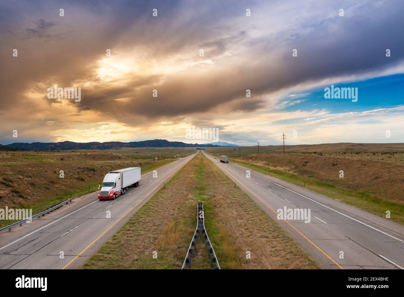 A semi truck at the I 25 interstate highway, in the State of Colorado, USA; Concept for freight transportation. Stock Photo