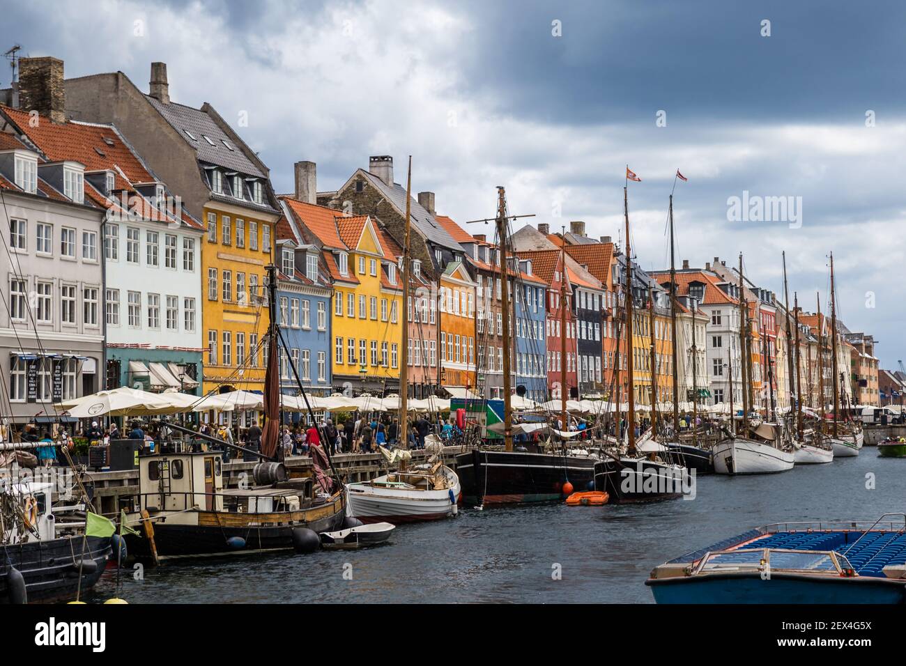 Nyhavn Pier with color Buildings, and Ships in Copenhagen, Denmark, Europe Stock Photo