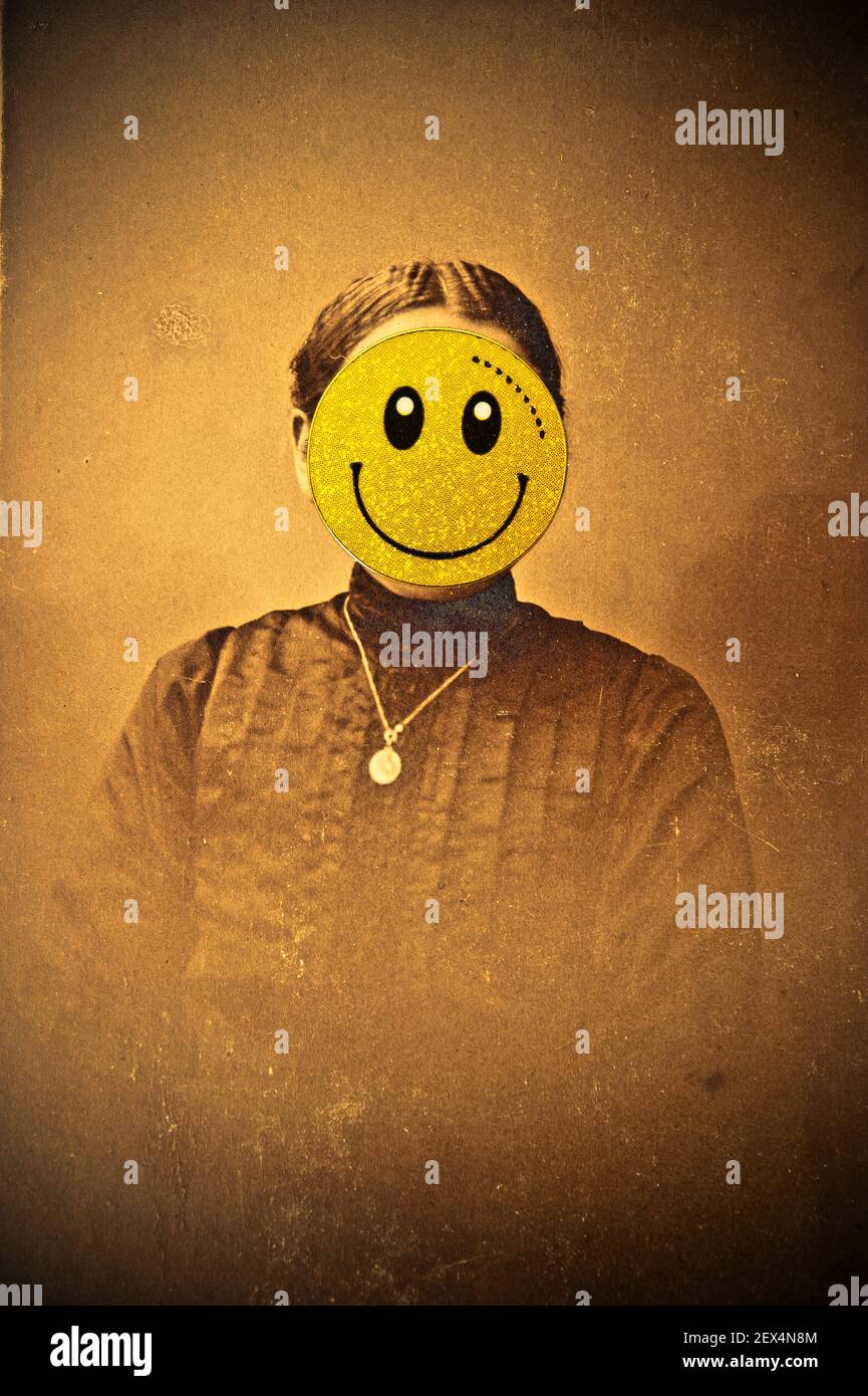 humorous antique portrait of a woman with a smiley emoticon covering her face Stock Photo