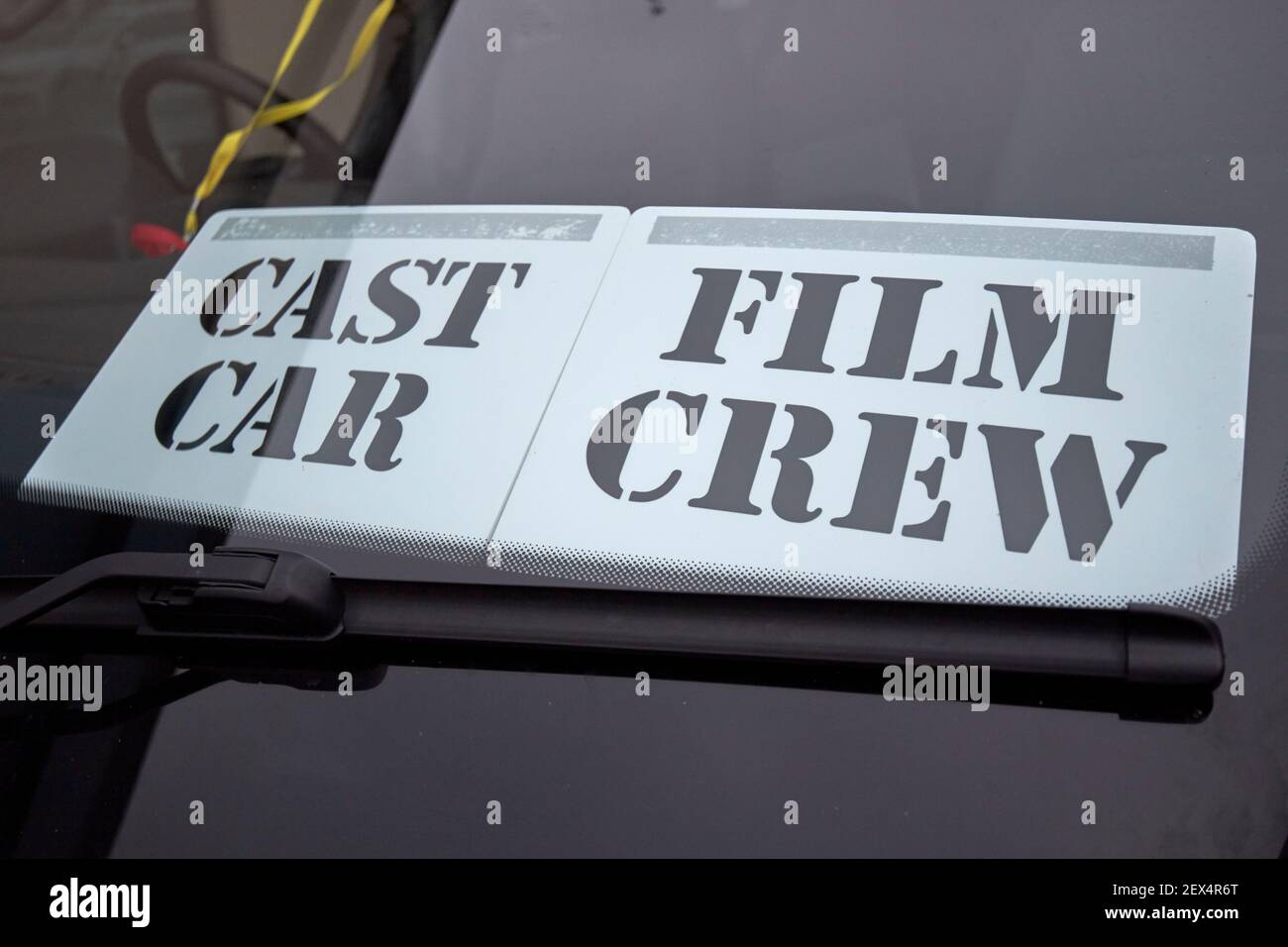 label in vehicle window indicating it is a cast car for film crew filming a movie in northern ireland Stock Photo