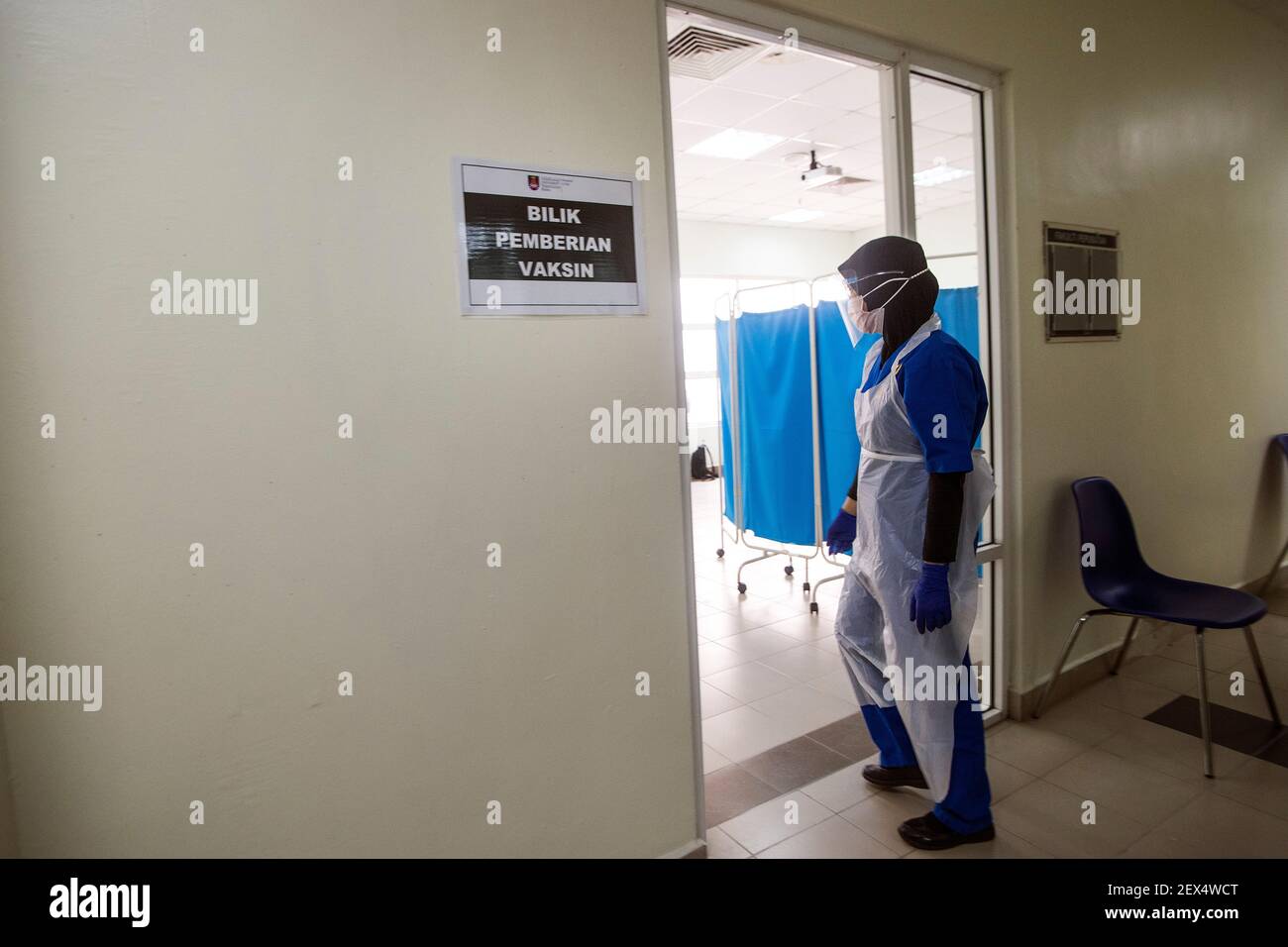 A Health Worker Wearing A Personal Protective Equipment Suit Ppe Walks Into A Vaccination Room At The Uitm Hospital In Sungai Buloh The Malaysia Government Says 500 000 Front Liners Of The Country
