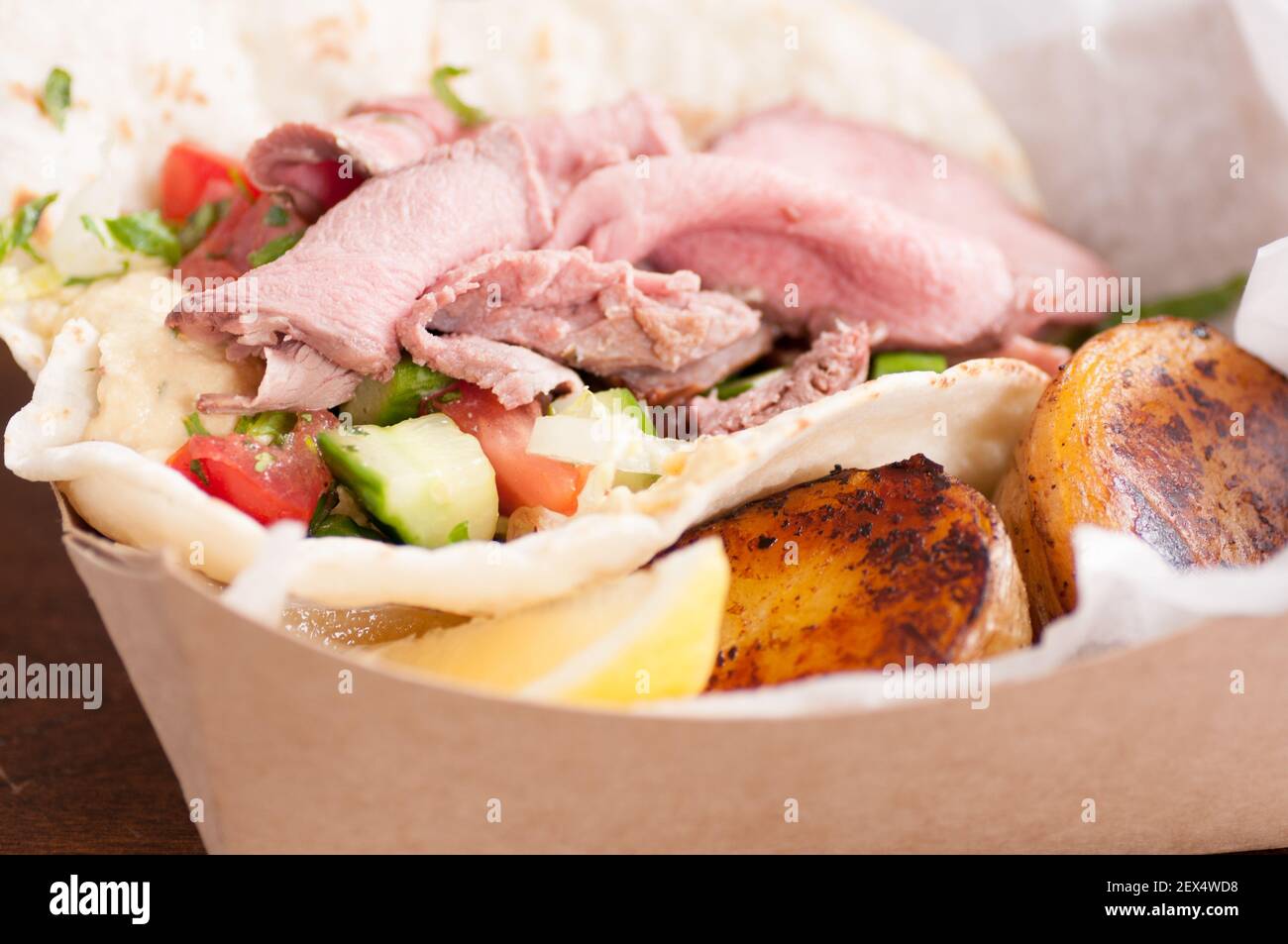 food truck meal of lamb wrap with roasted potato, shawarma style with