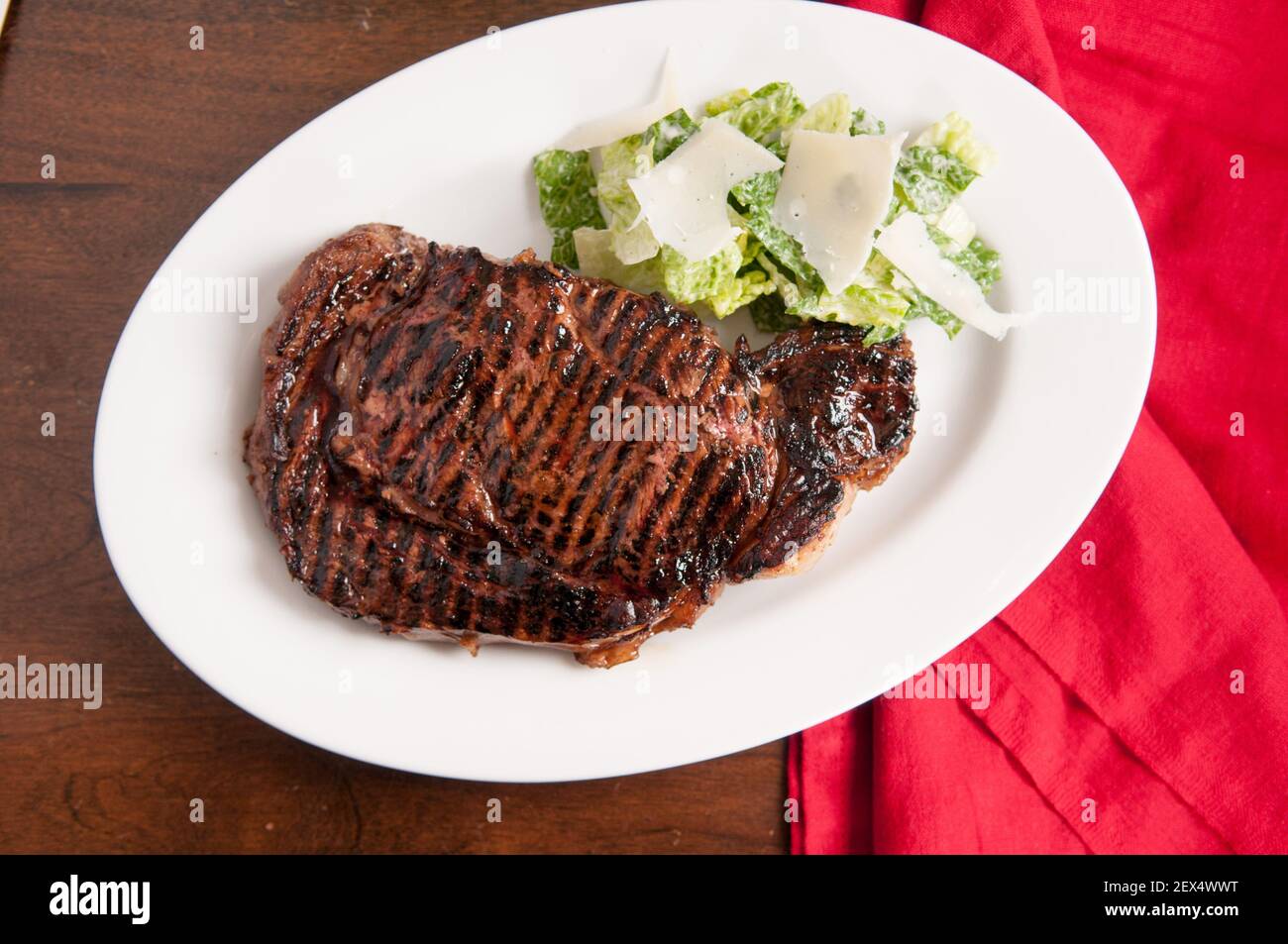 thick ribeye steak seared rare on a cast iron grill Stock Photo Alamy
