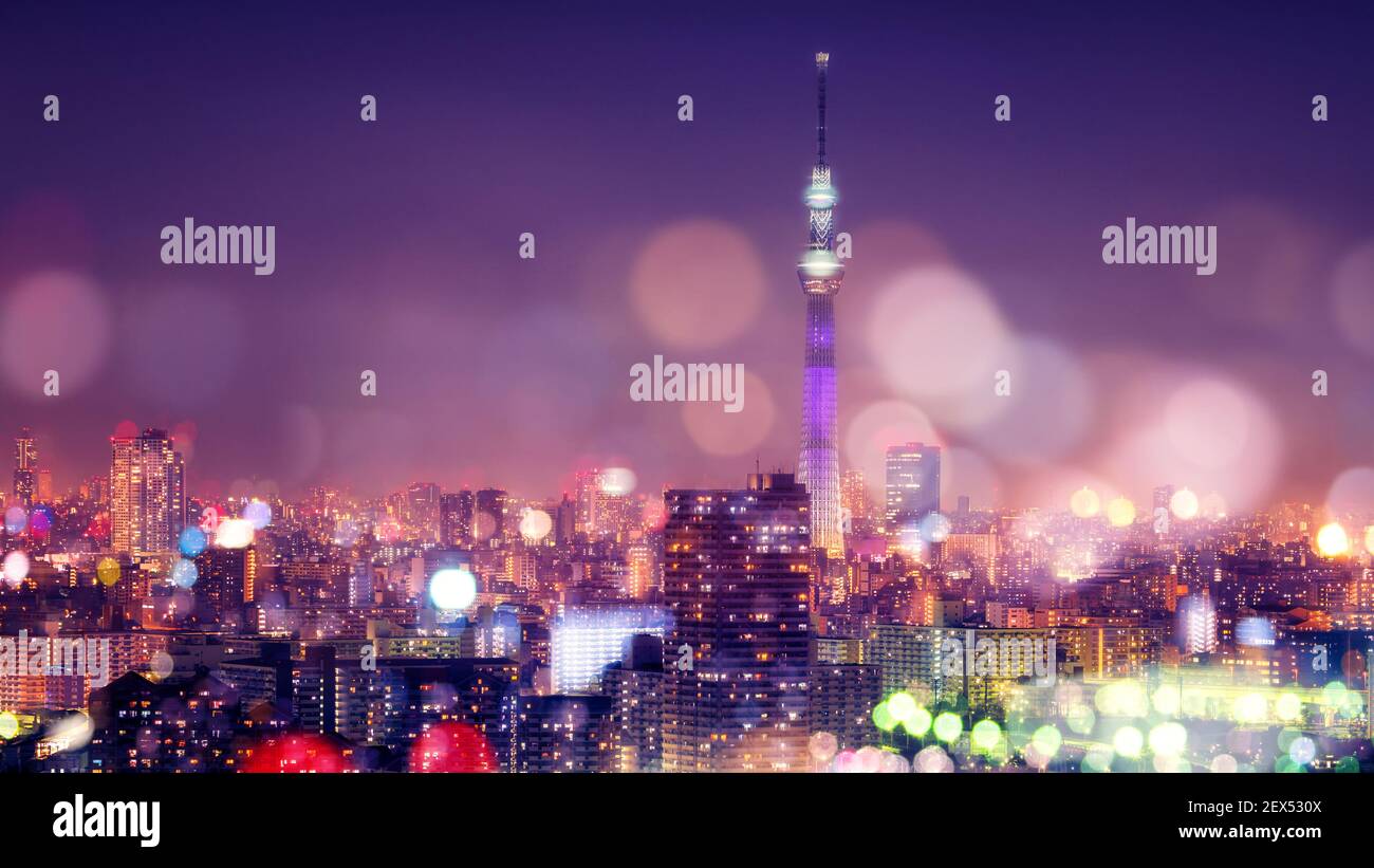 Nightlife in Tokyo. Tokyo Sky Tree with Blur Bokeh Lights Decoration in Colorful Filter. Tokyo Cityscape Background. Night sky and nightlife concept Stock Photo