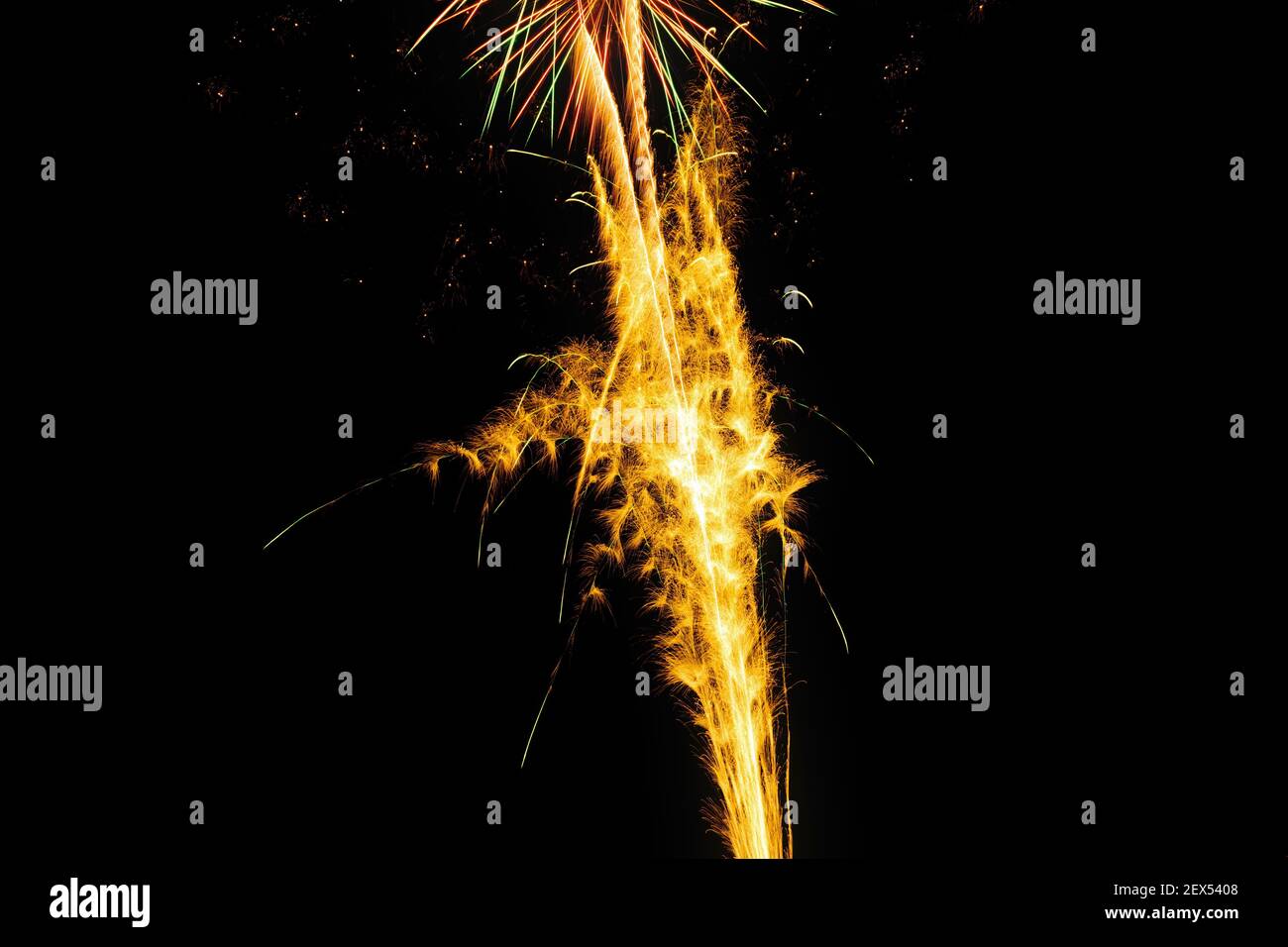 Image with a black background prepared to edit text of a firework, formed by yellow traces. Stock Photo