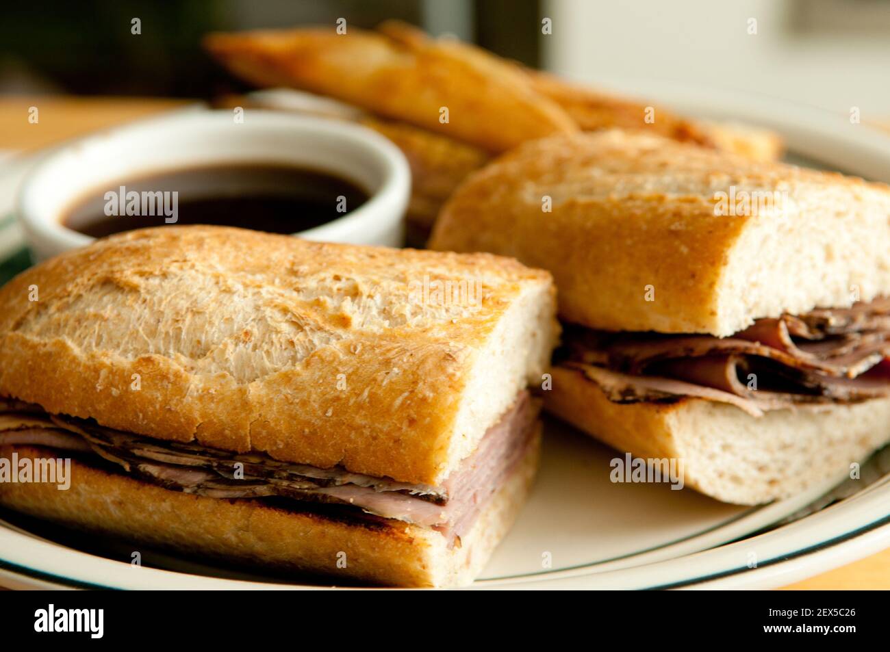 classic french dip au jus or beef dip with fries Stock Photo Alamy