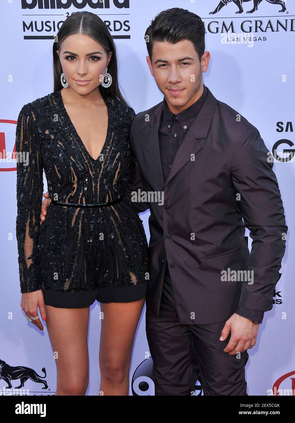(LR) Olivia Culpo and Nick Jonas arrives at the 2015 Billboard Music