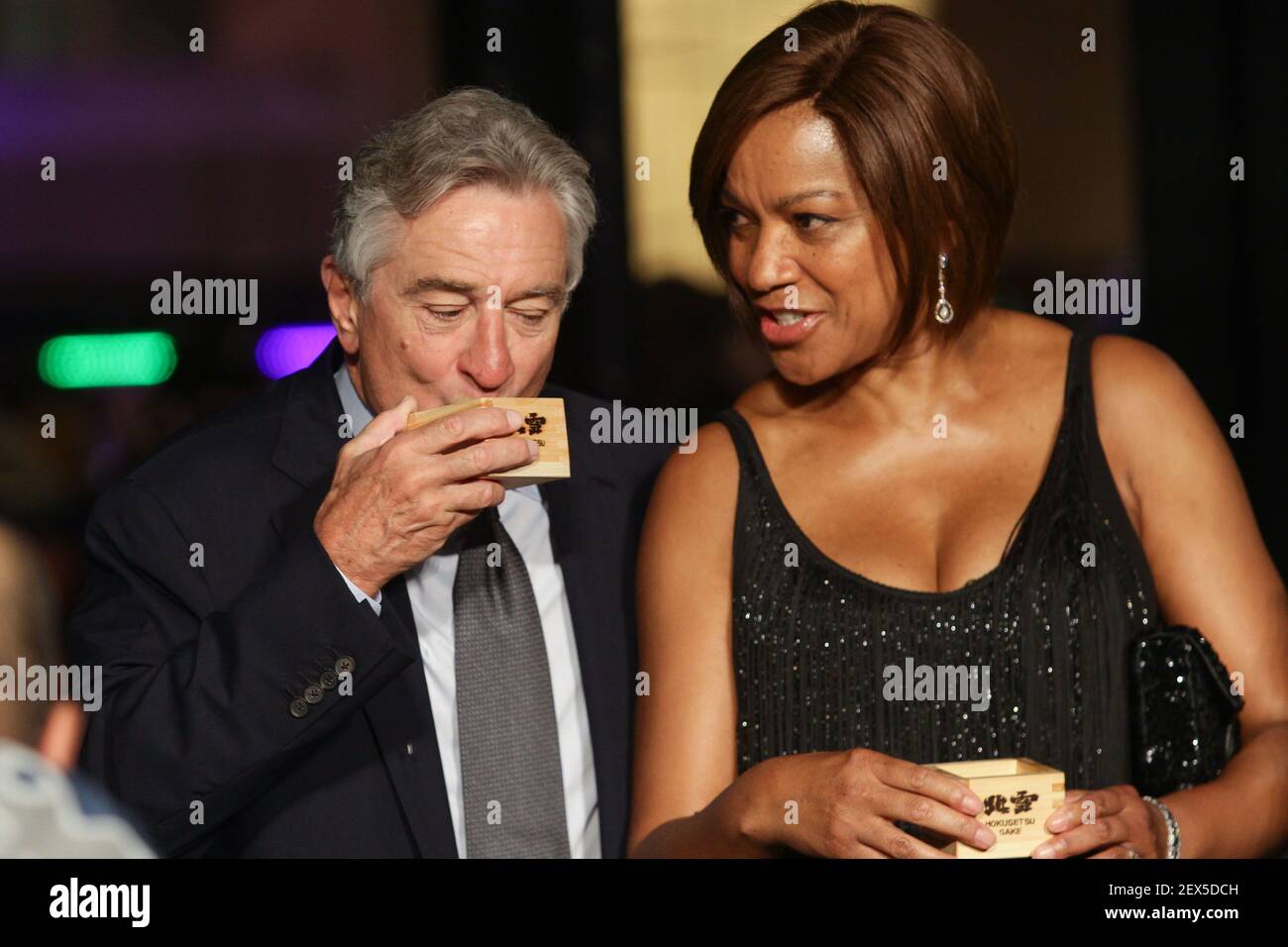 MAY 18, 2015 - Actor Robert De Niro (L) drinks sake with wife, Grace Hightower De Niro (R) during the opening of Nobu Hotel in Pasay City. Nobu hotel in Manila is the first Nobu Hotel in Asia. (Photo by Mark Cristino / Pacific Press) *** Please Use Credit from Credit Field *** Stock Photo