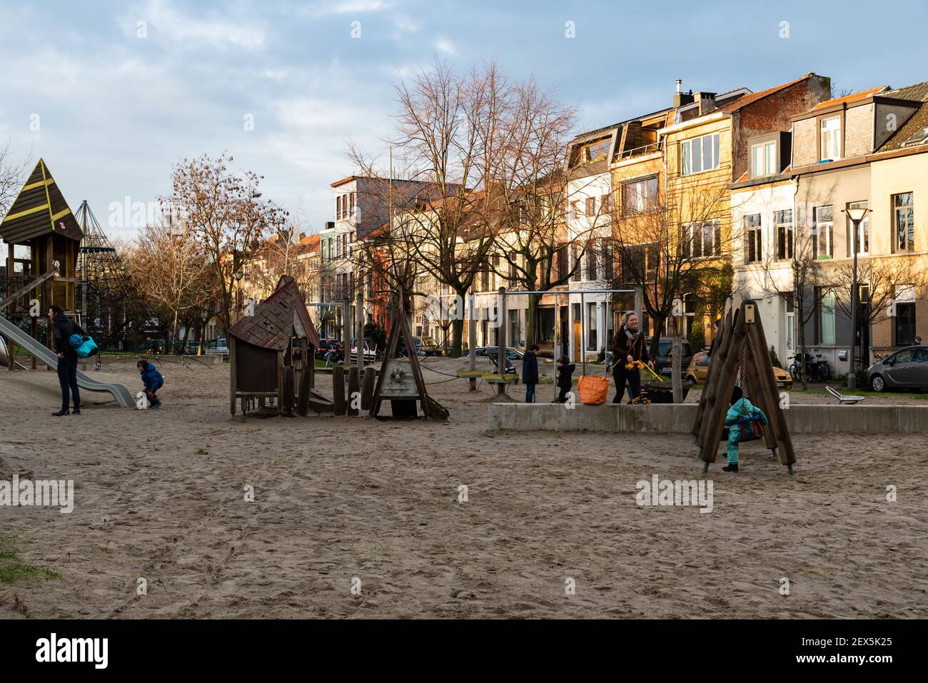 Antwerp, Flanders - Belgium - 12 28 2020: Public children playground in a residential area with low, golden sunlight Stock Photo