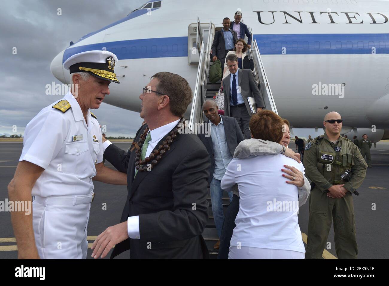 Secretary of Defense Ash Carter is greeted by Admiral Samuel Locklear, III, as he and his wife Stephanie arrive in Honolulu, Hawaii, May 26, 2015, as Carter begins his second Asia-Pacific trip since taking office earlier this year. While in Hawaii Carter will attend the PACOM change of command ceremony Wednesday. (Photo by Glenn Fawcett/DoD) *** Please Use Credit from Credit Field *** Stock Photo