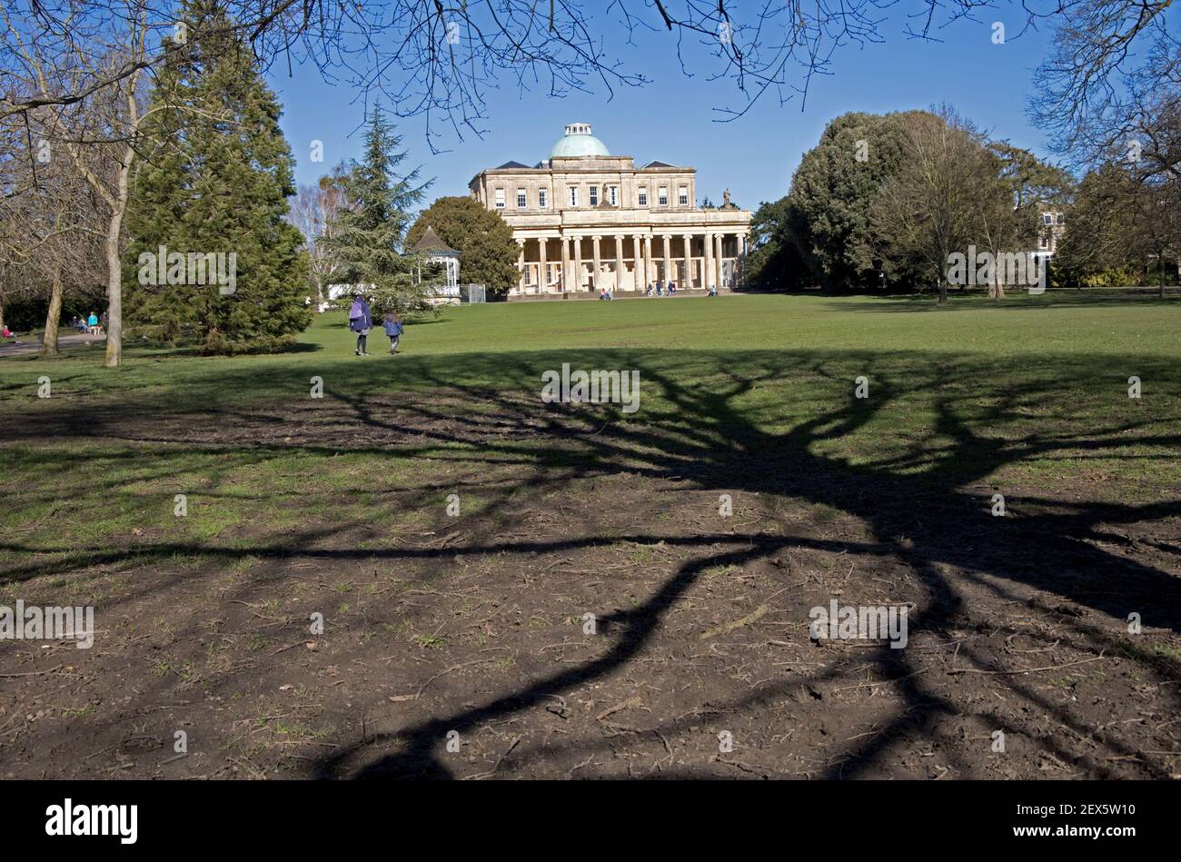 Pittville Puimp Rooms in Pittville Park Cheltenham the largest spa for mineral waters in Cheltenham opened in 1830 taken on a sunny day at the end of Stock Photo