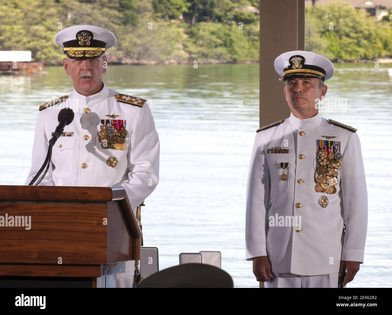 PEARL HARBOR (May 27, 2015) Adm. Scott H. Swift reads his orders as he assumes command of U.S. Pacific Fleet from Adm. Harry B. Harris Jr., right, during the joint U.S. Pacific Command and U.S. Pacific Fleet change of command ceremony at Joint Base Pearl Harbor-Hickam. Swift relieved Harris as the U.S. Pacific Fleet commander and Harris assumed command of U.S. Pacific Command from Adm. Samuel J. Locklear III. (Photo by Mass Communication Specialist 2nd Class Diana Quinlan/U.S. Navy) *** Please Use Credit from Credit Field *** Stock Photo