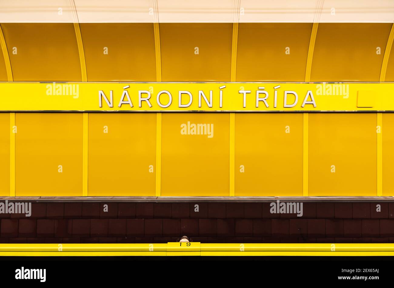 Prague - Czech Republic - 08 01 2020: Yellow wall of the metro tunnel of the Narodni Trida station Stock Photo