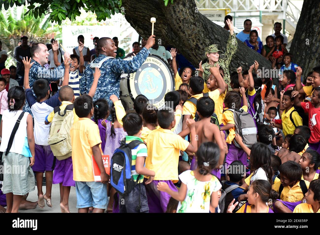 TARAWA, Kiribati (June 4, 2015) Members of the U.S. Pacific Fleet Band entertain a group of kids at a concert in Bairiki Square during a Pacific Partnership 2015 visit to the Independent Republic of Kiribati. Now in its 10th iteration, Pacific Partnership is the largest annual multilateral humanitarian assistance and disaster relief preparedness mission conducted in the Indo-Asia-Pacific Region. (Photo by Chief Mass Communication Specialist Jonathan R. Kulp/U.S. Navy) *** Please Use Credit from Credit Field *** Stock Photo