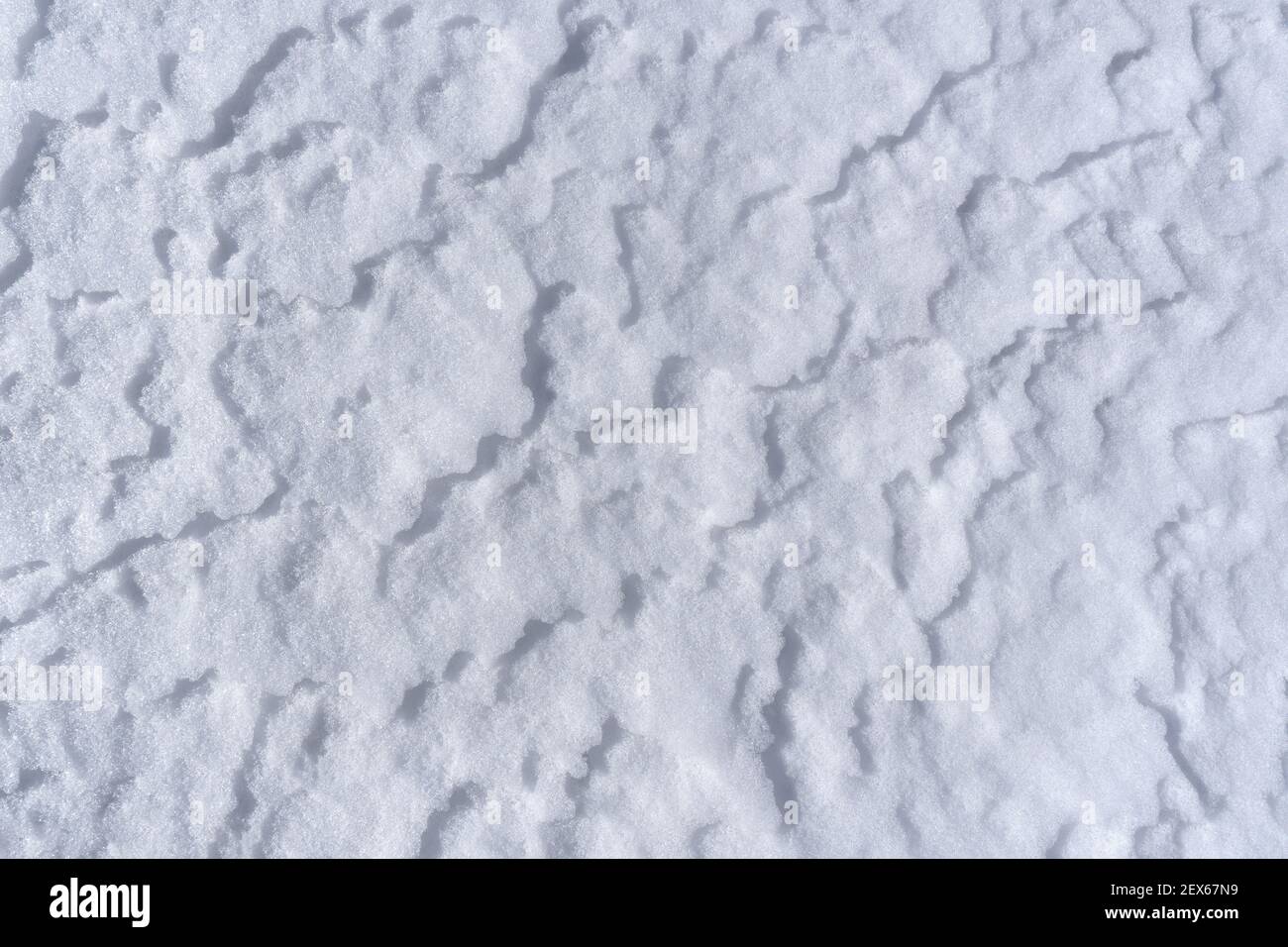 Snow surface with light drifts in closeup Stock Photo