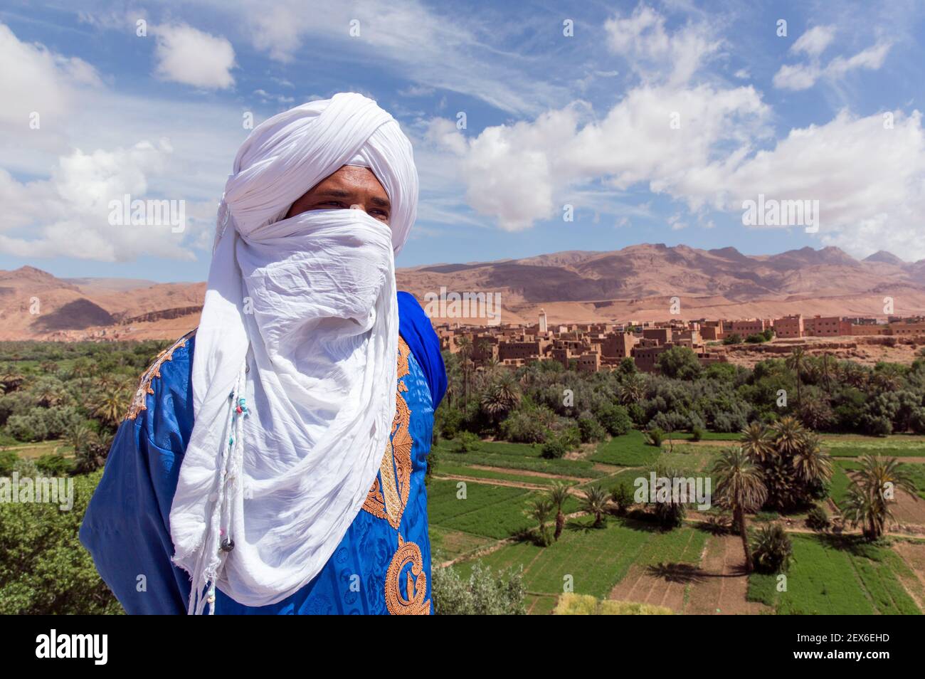 portrait of a male Berber in a traditional garb with a landscape on the back ground Stock Photo