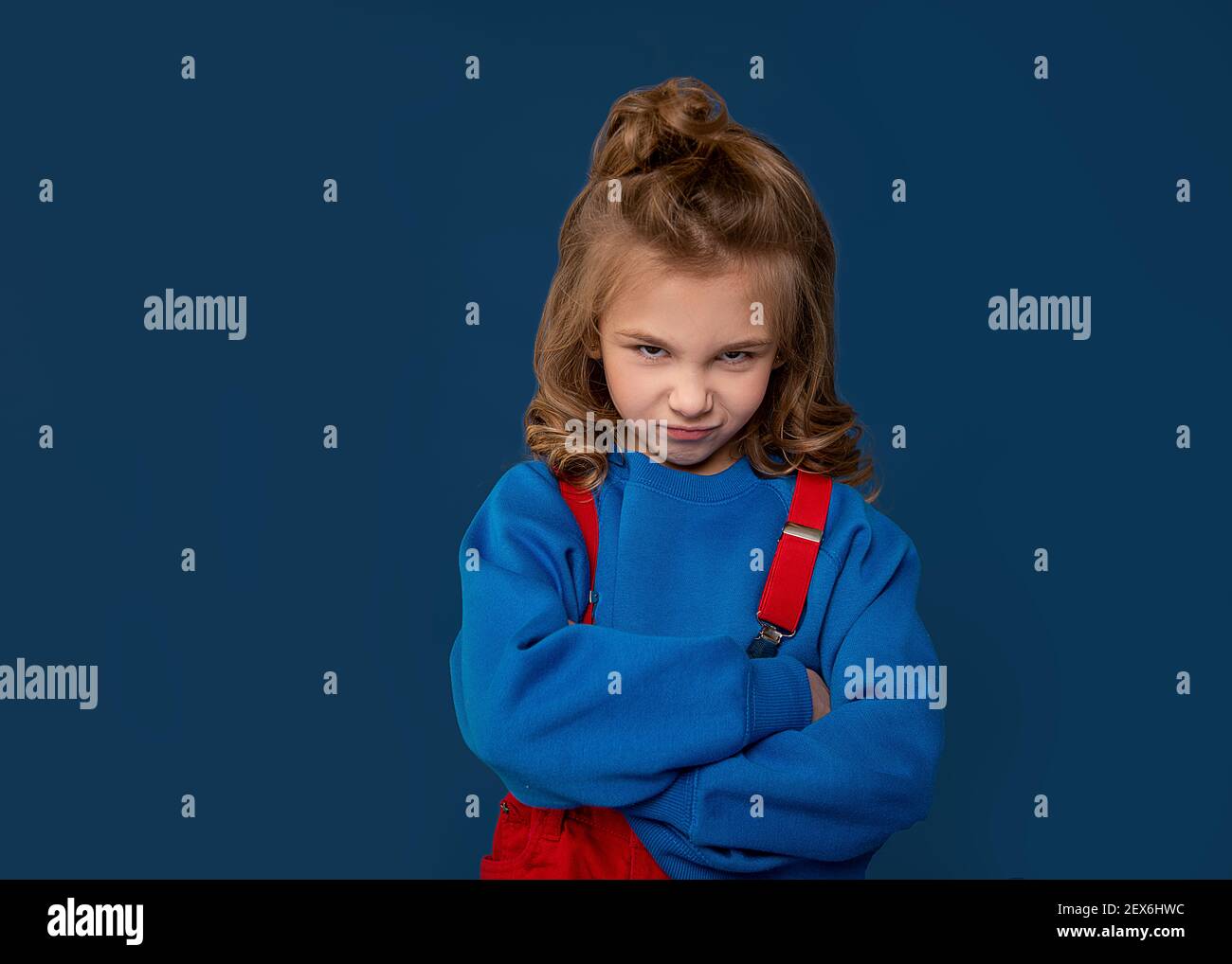 Spoiled child, naughty baby, kids whims. Beautiful little girl showing character. Child crisis psychology concept. Close-up portrait Stock Photo