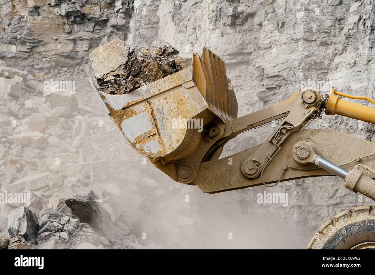 03 March 2021, Baden-Wuerttemberg, Nußloch: A wheel loader transports limestone in the quarry of the HeidelbergCement building materials group. Photo: Uwe Anspach/dpa Stock Photo