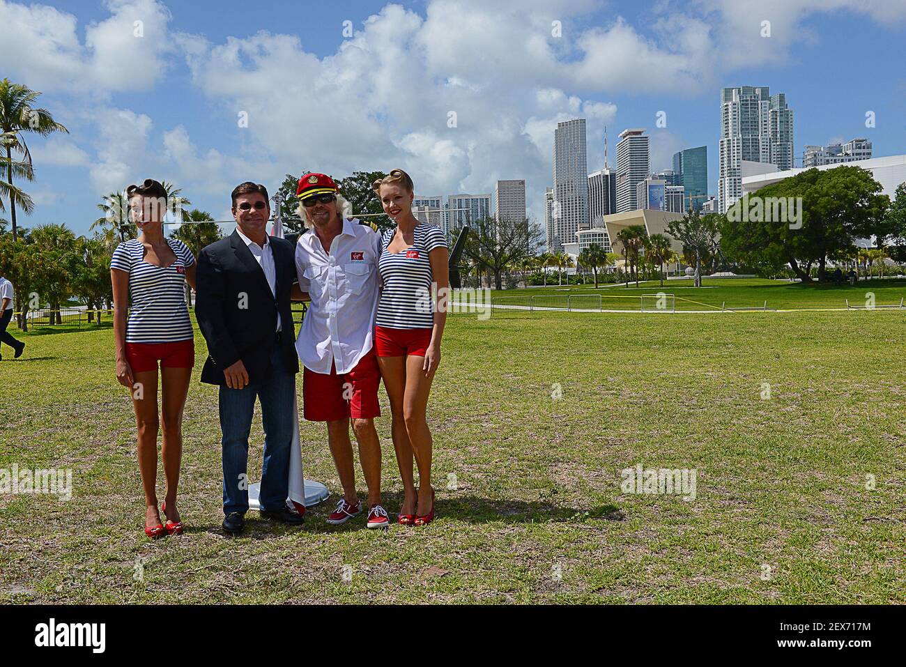 Richard Branson, founder of Virgin Group, third from left, with Virgin Cruises president and CEO Tom Alpin on his right and models at Perez Art Museum in Miami. (Photo by Taimy Alvarez/Sun Sentinel/TNS) *** Please Use Credit from Credit Field *** Stock Photo