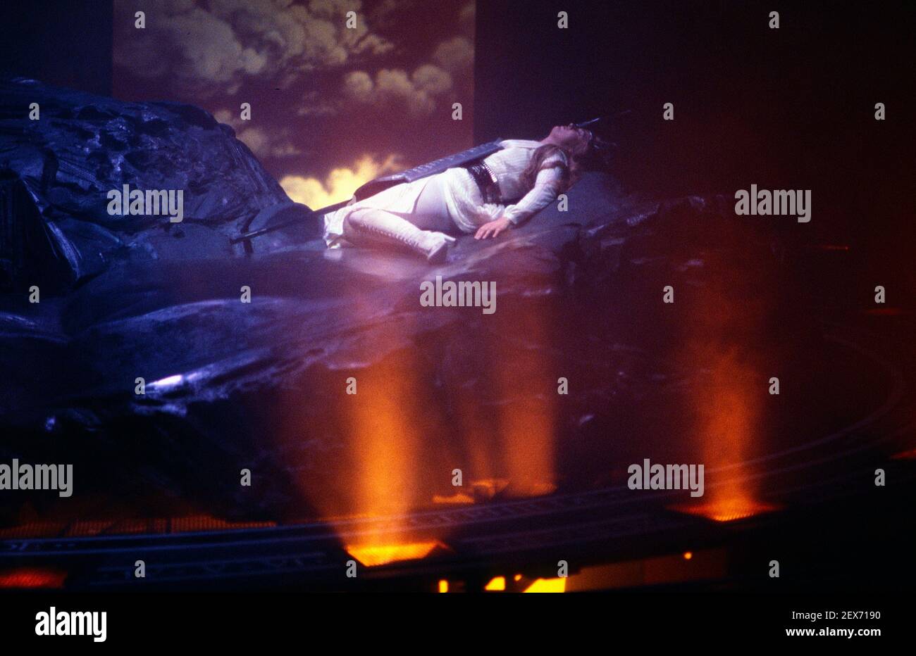 asleep, surrounded by protecting fire: Linda Esther Gray (Brunnhilde) in THE VALKYRIE by Wagner at English National Opera (ENO), London Coliseum  22/10/1983 conductor: Mark Elder  design: Maria Bjornson  director: David Pountney Stock Photo